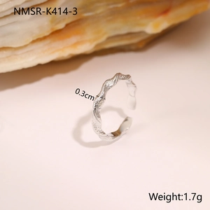 Detail view of 0.3cm wide textured titanium steel ring with irregular hammered surface