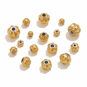Detailed macro view of 18K gold plated baroque pumpkin spacers for DIY jewelry