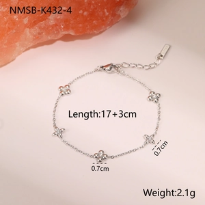 Detail of silver clover bracelet with zircon inlay and adjustable stainless steel chain