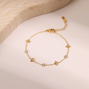 Detailed macro view of 18k gold plated titanium bracelet with zircon stars