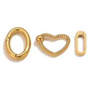 Detailed close-up of polished 18K gold plated heart and oval spring clasps for DIY jewelry