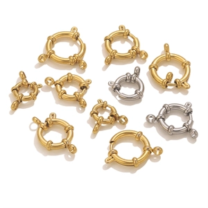 Detailed macro view of 18K gold and silver spring circle clasps for DIY jewelry making