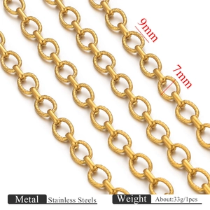 Macro detail of 18k gold plated stainless steel twisted and smooth oval link chain