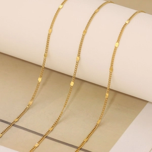 Detail of 18k gold plated stainless steel curb chain with flat oval sequins links