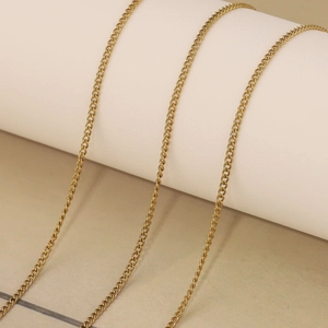 Detailed close-up of three 18k gold plated stainless steel curb chains for DIY jewelry