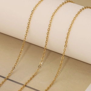 Detailed macro view of 18k gold plated stainless steel cable chain jewelry components