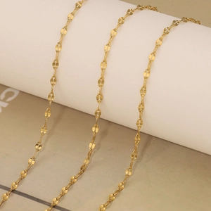 Detail of 18k gold plated stainless steel satellite chain with petal-shaped links
