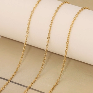 Macro shot of 18k gold plated stainless steel bead chain with textured links