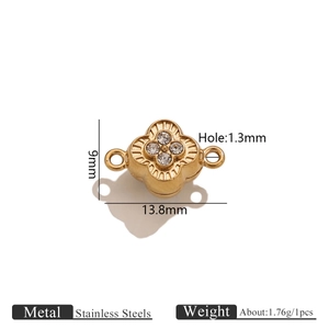 Macro shot of 13.8mm gold stainless steel clover magnetic clasp with crystal detail