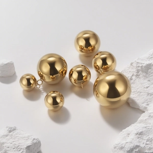 Polished gold hollow sphere pendants in various sizes for DIY jewelry making