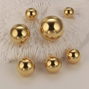 Polished gold stainless steel hollow ball pendants in various sizes for jewelry DIY