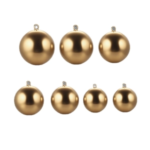 Golden stainless steel spherical pendants in various sizes with polished satin finish