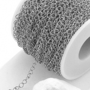 Macro detail of high-quality stainless steel flat O-chain roll for DIY jewelry making