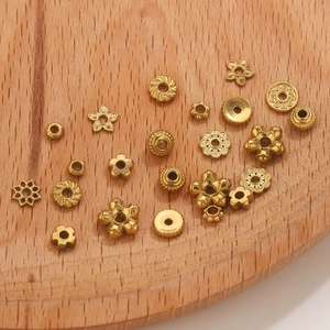 DIY 18K gold plated stainless steel spacer beads in floral and star shapes for jewelry