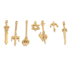 Detailed set of seven golden DIY stainless steel pendants featuring assorted weapon charms