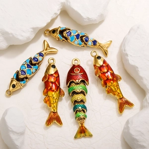 Macro view of articulated enamel fish pendants with movable joints and vibrant colors