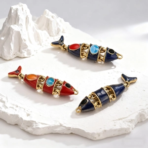 Artistic movable fish pendants in red and blue enamel with gold plating on white stone