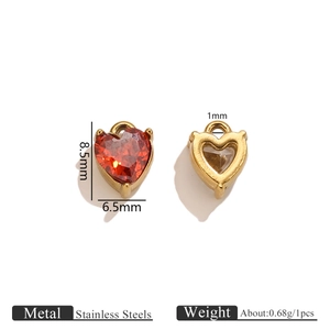 Stainless steel heart pendant with red zircon and golden prongs in front and back view