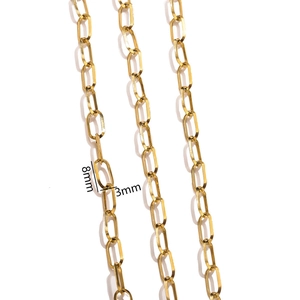 Macro detail of 18K gold-plated paperclip chain with 8mm by 3mm link size measurements