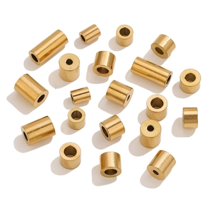 Macro detail of vintage golden stainless steel cylinder beads for DIY jewelry making
