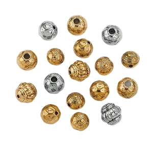 Perles en métal vintage avec gravures florales et motif cœur en finitions or et argent
