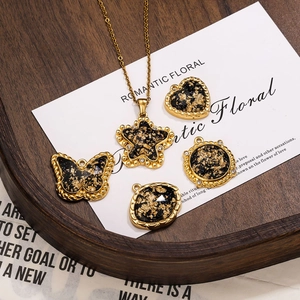 Vintage black gold foil charms set with heart and butterfly shapes for DIY jewelry