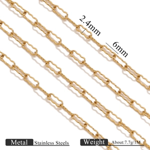 Macro detail of gold stainless steel wave chain with 2.4mm by 6mm irregular links