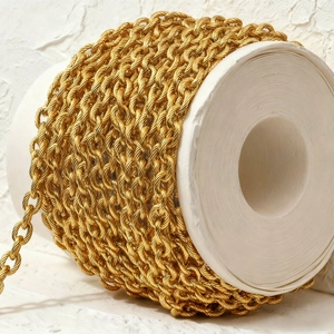 Golden twisted rope chain on white spool for vintage DIY jewelry making projects