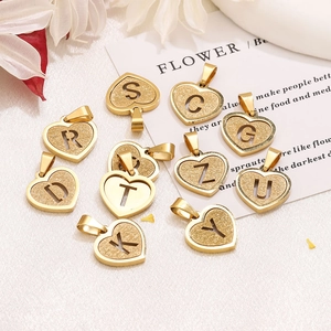 Gold stainless steel heart pendant with sandblast texture and cut-out letters for DIY jewelry
