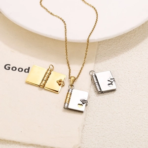 Detailed view of stainless steel envelope locket pendants with heart clasp designs