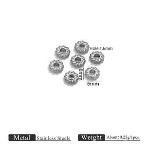 Macro detail of 6mm twisted stainless steel spacer beads with 1.6mm hole for jewelry making