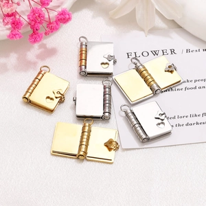 Polished stainless steel envelope book necklaces in gold and silver with heart cutouts