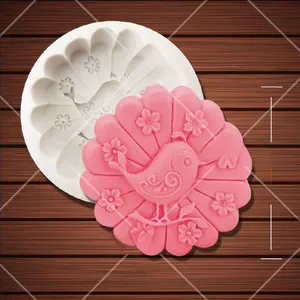 Close-up of bird and flower silicone mold showing a 7.2cm pink floral finished product