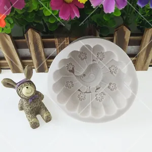 Detail view of white bird and flower silicone mold for fondant and cake decorating