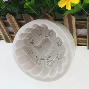 Macro detail of bird and floral pattern engraving on silicone DIY craft mold