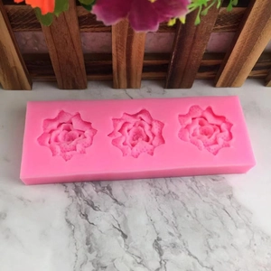 Pink 3-cavity rose flower silicone mold for DIY fondant cake decorating on marble