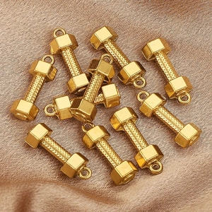 Matte gold dumbbell charms in stainless steel with knurled texture for DIY jewelry making