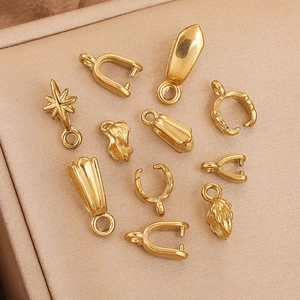 Various gold plated stainless steel pinch bails for DIY jewelry making in assorted shapes