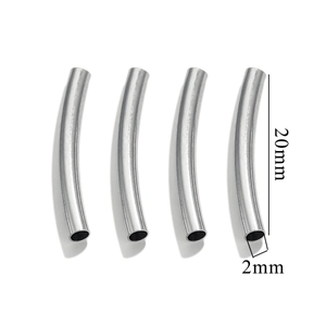 Macro shot of four 20x2mm polished silver curved tube beads for DIY jewelry making