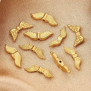 Golden vintage wing beads in stainless steel for DIY jewelry making with matte finish