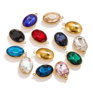 Macro view of assorted oval faceted crystal pendants with gold edges for DIY jewelry making