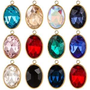 Macro view of 12 faceted oval crystal pendants with gold metal frames for DIY jewelry