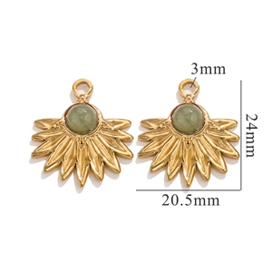 Detailed view of bohemian gold sunflower pendants with green natural stone inserts