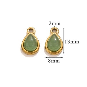 Macro detail of teardrop green stone pendants with gold frame and size markings
