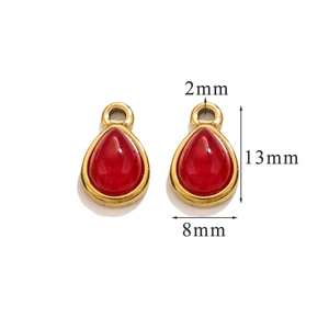 Macro shot showing 13mm red teardrop stone charms in gold stainless steel frames