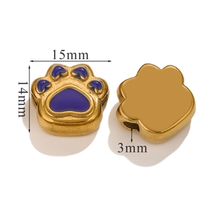 Detailed size view of golden paw-shaped stainless steel beads with purple enamel coating
