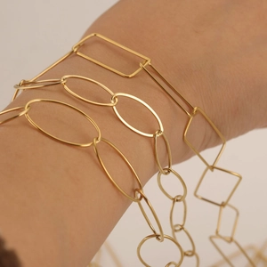 Three minimalist 18K gold plated chain bracelets featuring rectangular and oval links