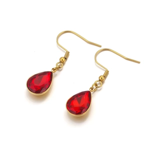 Elegant gold drop earrings featuring pear-cut red crystal stones on a clean white background