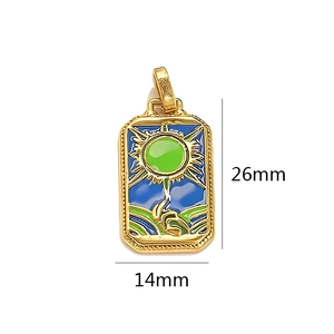 Detail of tarot card sun pendant in gold-plated stainless steel and colorful enamel