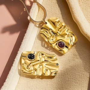 Modern twisted stainless steel pendant necklace with purple and black natural stones